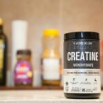 Creatine monohydrate from Jacked Factory displayed on a kitchen counter.